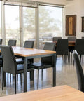 Black Adelaide Function Chairs With Black Legs And Custom Timber Table Tops At Lambert Estate