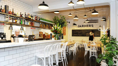 Bentwood White Side Chairs And White Stools With Custom Tasmanian Oak Tops With Cross Table Base In Front Bar At Jarmers Kitchen