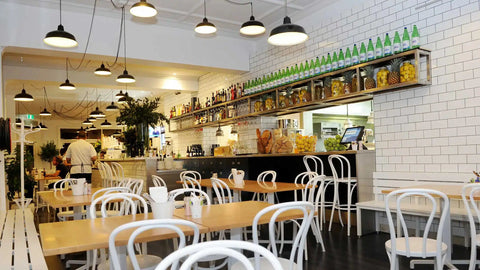 Bentwood White Chairs And Custom Tasmanian Oak Tops With Cross Table Base And Custom Timber Bench Seating At Jarmers Kitchen
