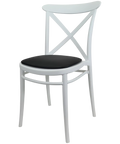 Cross Chair By Siesta In White With Black Vinyl Seat Pad, Viewed From Angle