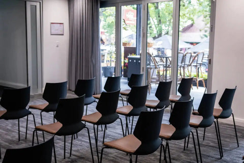 Fly Side Chairs With Custom Seat Pads In Conference Room At The Haus Restaurant