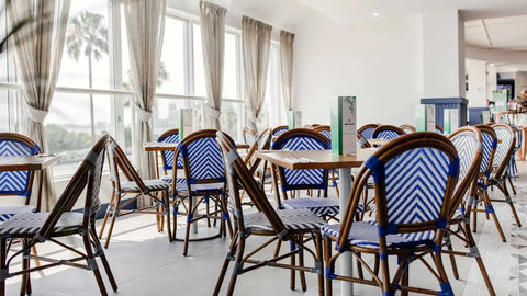 Carlton RounD Table Base With Rubberwood Table Tops And Jasmine Chairs In Dining Area At Hotel Pacific 5