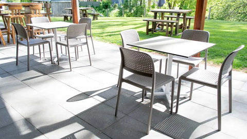 Lido Side Chairs With Compact Laminate Table Tops And Cross Table Base At Wolf Blass Alfresco