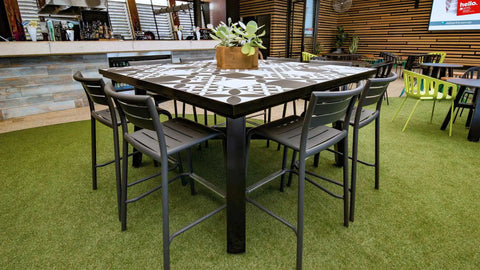 Marco Stools With A Custom Tiled Table At Highlander Hotel