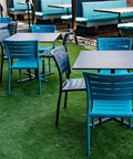 Black And Teal  Marco Chairs With Custom Compact Laminate Tops At Highlander Hotel