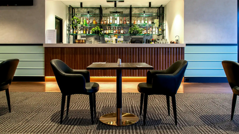 Mulberry Armchairs With Walnut Table Tops And Carlita Table Bases At The Bridgeway Hotel