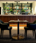 Mulberry Armchairs, Walnut Table Tops And Carlita Table Bases At The Bridgeway Hotel