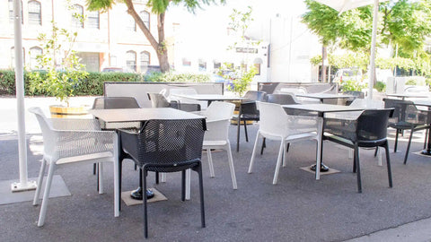 Black And White Net Armchairs With Compact Laminate Table Tops At Rob Roy Hotel