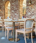 Sienna Chairs In Natural With Carlton Table BAses And Natural Elm Table Tops  At Rezz Hotel 