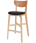 Romano Bar Stool With Natural Frame And Backrest With A Black Vinyl Seat, Viewed From Angle In Front