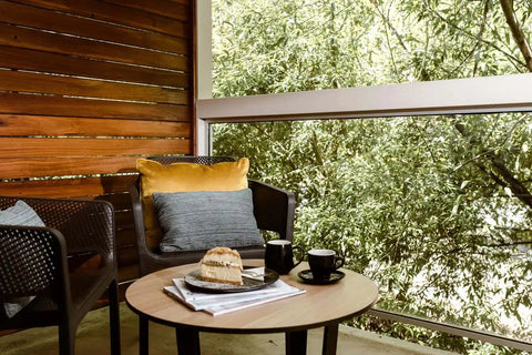 Lila Coffee Table Base With Compact Laminate Table Top And Net Armchairs On Balcony At The Manna Of Hahndorf