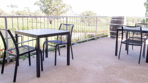 Black Waverly Side Chair And Compact Laminate Table Tops In Outdoor Dining At Lambert Estate