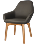 Monte Tub Chair With Light Oak Timber 4 Leg And Charcoal Vinyl Shell, Viewed From Angle In Front