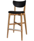 Romano Bar Stool With Black Vinyl Upholstered Backrest And Seat With Light Oak Timber Frame, Viewed From Angle In Front