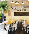 Bentwood White Chairs And Tasmanian Oak Table Tops With Cross Table Base In Dining Area At Jarmers Kitchen