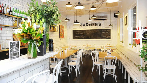 Bentwood White Chairs And Tasmanian Oak Table Tops With Cross Table Base In Dining Area At Jarmers Kitchen