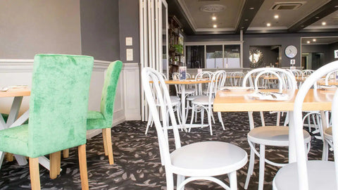 Custom Coleman Bistro Chairs With Natural Rubberwood Tops And Davido Bases In The Dining Room At Kingsford Hotel