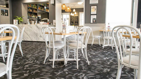 Custom Powdercoated Coleman Bistro Chairs With Vinyl Seat Pads And Natural Rubberwood Table Tops And Davido Bases In The Dining Room At Kingsford Hotel