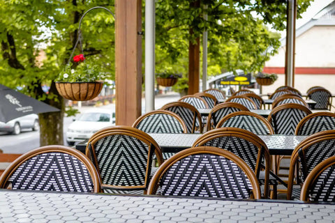 Jasmine Stools And Custom Tiled Tables In Outdoor Dining Area At The Haus Restaurant