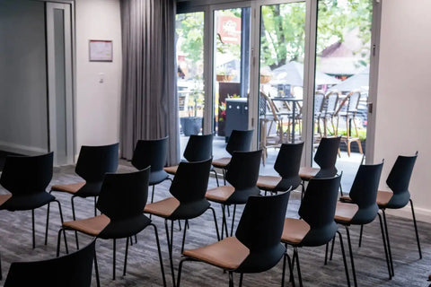 Fly Side Chairs With Custom Seat Pads In Conference Room At The Haus Restaurant