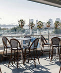 Jasmine Stools And Cross By S.C.A.B Table Base with  Compact Laminate Table Tops In Outdoor Dining At Hotel Pacific