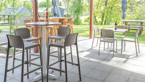 Lido Bar Stools And Chairs With Compact Laminate Table Tops And Cross Table Bases In Outdoor Area At Wolf Blass Alfresco