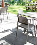 Lido Side Chairs With Compact Laminate Table Tops And Cross Table Base At Wolf Blass Alfresco