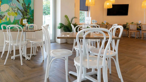 No 18 bentwood chairs in white with Elm table tops in natural and Filip table bases with Sienna Chairs in the background