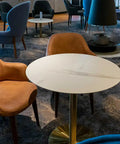 Mulberry Armchair And Carlita Round Table Base With Compact Laminate Top In Lounge At Bespoke Wine Bar Kitchen