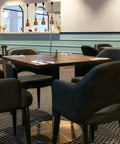 Mulberry Armchairs, Walnut Table Tops, And Carlita Table Bases At The Bridgeway Hotel
