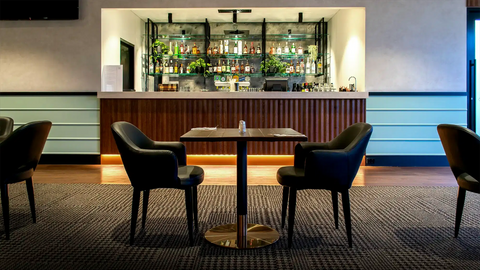 Mulberry Armchairs, Walnut Table Tops And Carlita Table Bases At The Bridgeway Hotel