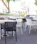 Black And White Net Armchairs With Compact Laminate Table Tops At Rob Roy Hotel