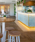 Nika Bar Stool With Custom Upholstered Seat Pad At The Lighthouse Wharf Hotel