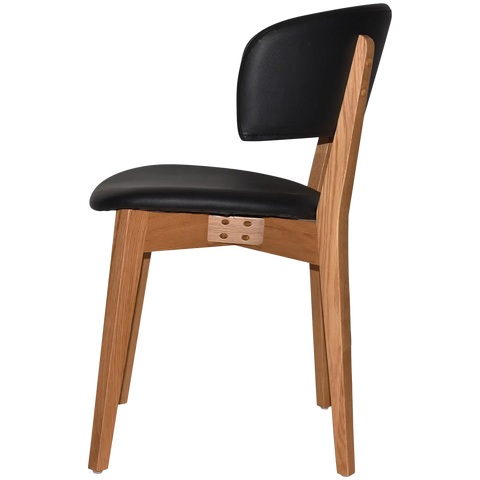 Palermo Chair With Black Vinyl Upholstery And Light Oak Timber Frame, Viewed From Side