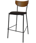 Ronaldo Bar Stool With A Black Metal Frame With A Black Vinyl Seat And A Light Walnut Backrest, Viewed From Angle In Front