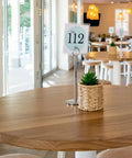 Round Elm Table Tops At The Lighthouse Wharf Hotel