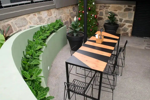Jet Bar Stools and Custom Compact Laminate Table Tops On A Henley Table Base At The Gully Public House & Garden