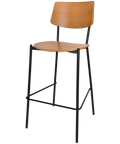 Venice Bar Stool With Black Frame And Light Oak Seat And Backrest, Viewed From Angle In Front