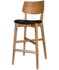 Vinnix Bar Stool With Light Oak Timber Frame And Black Vinyl Upholstered Seat, Viewed From Angle In Front