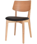 Vinnix Dining Chair With Natural Timber Frame And Backrest With A Black Vinyl Seat, Viewed From Angle In Front