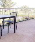 Black Waverly Side Chair And Compact Laminate Table Tops In Outdoor Dining At Lambert Estate
