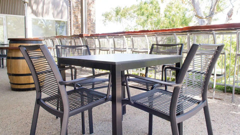 Waverly Side Chair And Custom Compact Laminate Tops In Outdoor Dining At Lambert Estate