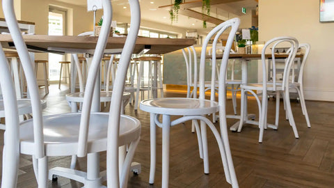 White Bentwood Chairs At The Lighthouse Wharf Hotel