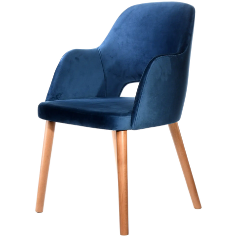 Alfi Armchair With Denim Velvet Shell And Trojan Oak Timber Legs, Viewed From Angle In Front