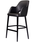 Alfi Bar Stool With Arms With Black Vinyl Shell And Black Timber Legs, Viewed From Angle In Front