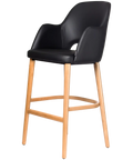 Alfi Bar Stool With Arms With Black Vinyl Shell And Trojan Oak Timber Legs, Viewed From Angle In Front