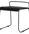Piper Low Stool With Black Seat And Black Sled Frame, Viewed From Angle In Front